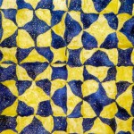 My variation on an Ohio Star quilt block created with with cut reverse applique yel