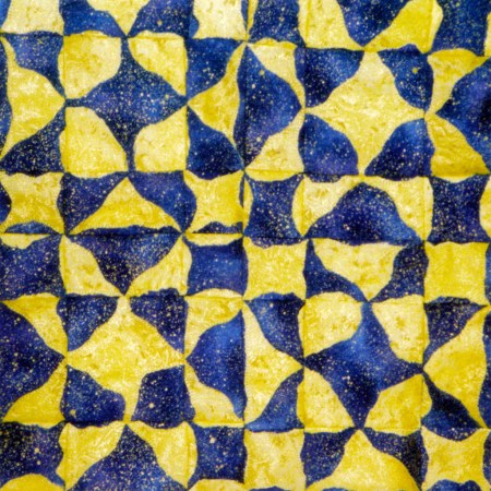 My variation on an Ohio Star quilt block created with with cut reverse applique yel