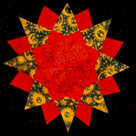 Red, gold and blue fabrics with space images make up a fabric sun which sits on a black, starry background